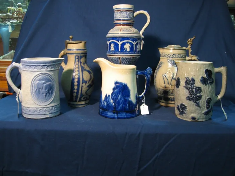 Grouping of Blue and Gray Stoneware, Including a Sleepy Eye Pitcher.